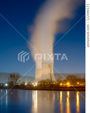 Nuclear power plant. View of cooling towers and water vapour. Production of electricity. Nuclear power plant. View of cooling towers and water vapour. Production of electricity. 122090171