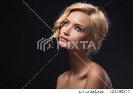 Beautiful girl with pretty face on dark background 122090835