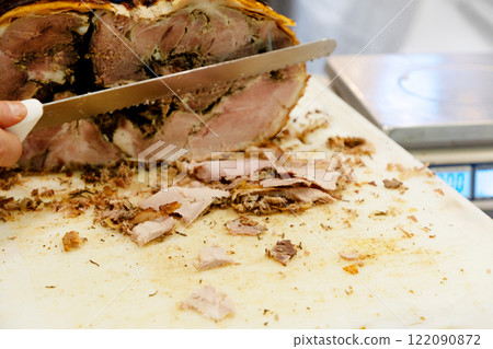 a large loaf of fresh farm ham and sausage ready for sale 122090872