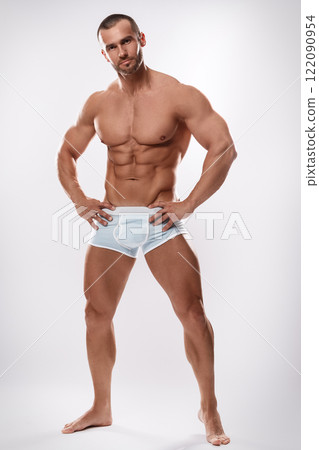 Handsome man posing wearing underwear on white background 122090954