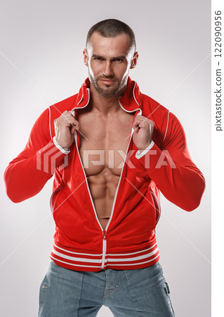 Handsome and muscular man in red jacket Handsome and muscular man in red jacket 122090956