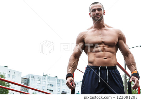 Man posing on the street after his workout Man posing on the street after his workout 122091295