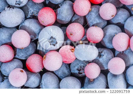 frozen multicolored blueberries and cranberries covered 122091759