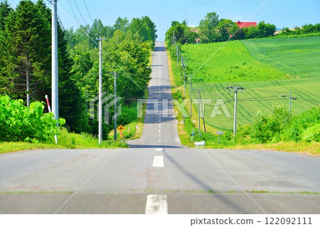 Roller Coaster Road, a famous spot in Kamifurano, Hokkaido 122092111