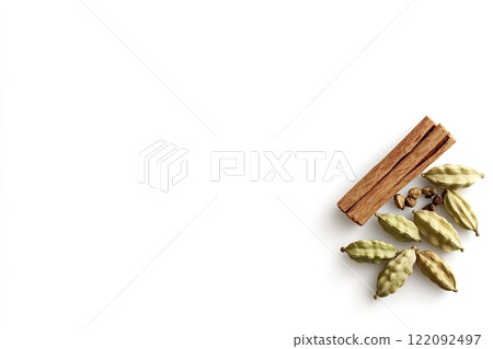 Cinnamon sticks and cardamom pods on white background 122092497