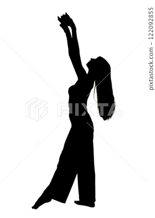 A silhouette of a woman dancing gracefully with arms raised high A silhouette of a woman dancing gracefully with arms raised high 122092855