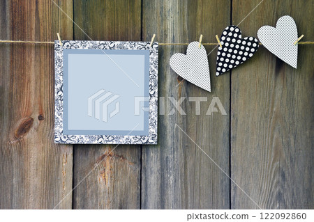 Heart with polka dots on the old wooden background. 122092860