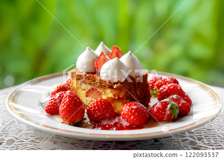 Strawberry and custard cream millefeuille with a green terrace background 122093537