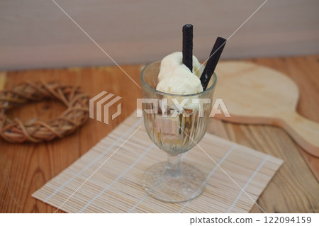 Glass filled with ice cream and wafer Glass filled with ice cream and wafer 122094159