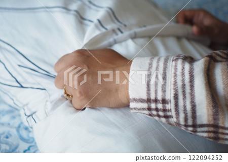 Woman Puts Pillow Into Pillowcase. Woman Puts Pillow Into Pillowcase. 122094252