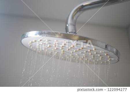 A Modern Showerhead Designed for Optimal Water Flow in a Stylish Minimalist Bathroom Setting A Modern Showerhead Designed for Optimal Water Flow in a Stylish Minimalist Bathroom Setting 122094277