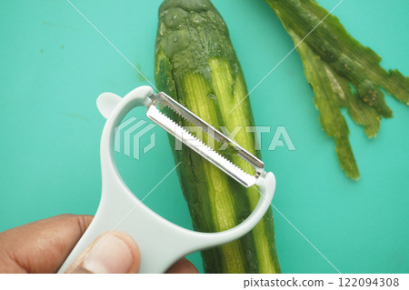 Preparing Fresh and Delicious Cucumbers using a Peeler for Your Meals Preparing Fresh and Delicious Cucumbers using a Peeler for Your Meals 122094308