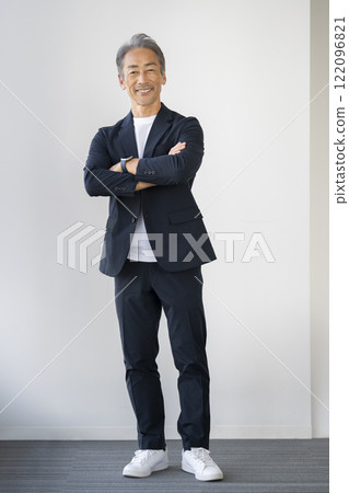 A man in his 60s smiling at the camera 122096821