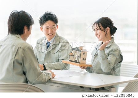 Architects, designers, workers, and engineers having a meeting about a house with a construction company, house maker, construction company, and builder. 122096845