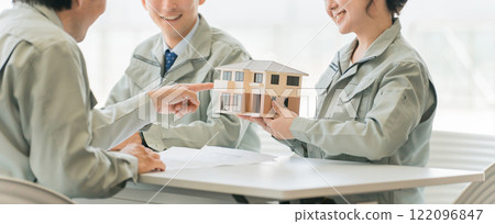 Architects, designers, workers, and engineers having a meeting about a house with a construction company, house maker, construction company, and builder. Architects, designers, workers, and engineers having a meeting about a house with a construction company, house maker, construction company, and builder. 122096847