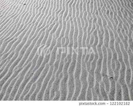 Beautiful sand ripples created by the wind blowing across the sand dunes 122102182