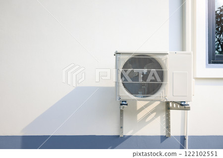 Condenser unit outside home. Condenser unit outside home. 122102551