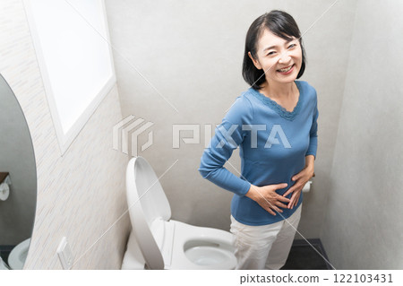Middle-aged woman with cured constipation Lifestyle image 122103431