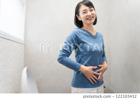 Middle-aged woman with cured constipation Lifestyle image 122103432