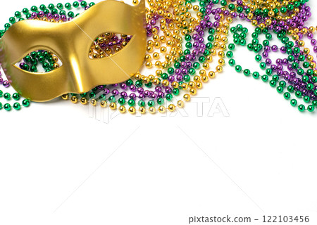 Mardi Gras beads and mask on white background 122103456