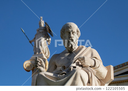 Marble statue of Greek philosopher Plato. Goddess Athena on background. 122105505