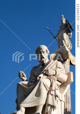 Marble statue of Greek philosopher Plato. Goddess Athena on background. 122105511