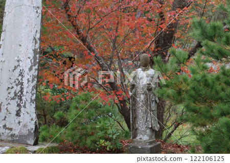 Jizo statue standing on Oshima Island, symbolizing the sacred ground of Matsushima Jizo statue standing on Oshima Island, symbolizing the sacred ground of Matsushima 122106125