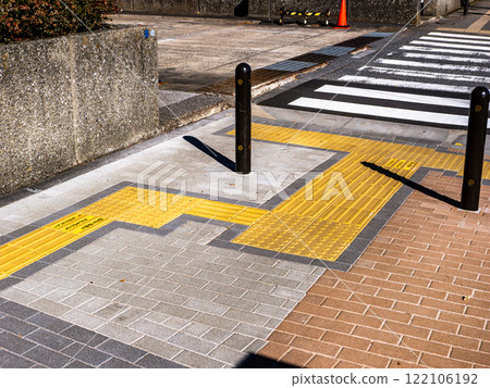 Example of braille block installation in front of a pedestrian crossing Example of braille block installation in front of a pedestrian crossing 122106192