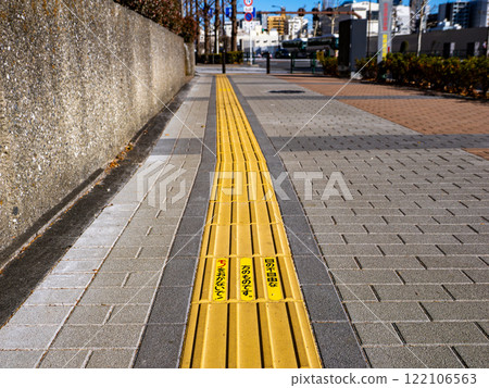 Example of braille blocks on a sidewalk 122106563