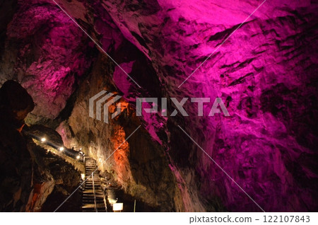 A cave lit up in red 122107843