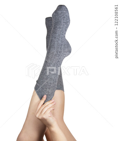 Gray warm high socks on woman legs elegant isolated on the white background Gray warm high socks on woman legs elegant isolated on the white background 122108561