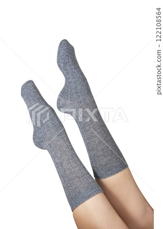 Gray warm high socks on woman legs elegant isolated on the white background Gray warm high socks on woman legs elegant isolated on the white background 122108564