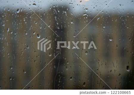 Wet window glass with raindrops cold weather Wet window glass with raindrops cold weather 122108665