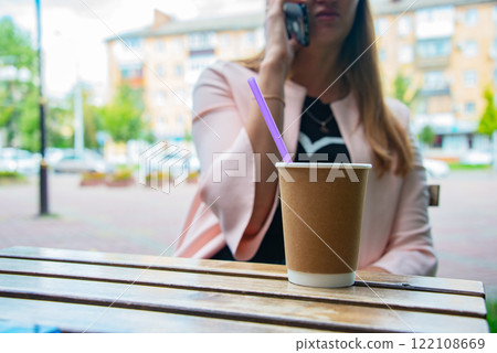 Paper coffee cup aromatic in woman hand Paper coffee cup aromatic in woman hand 122108669