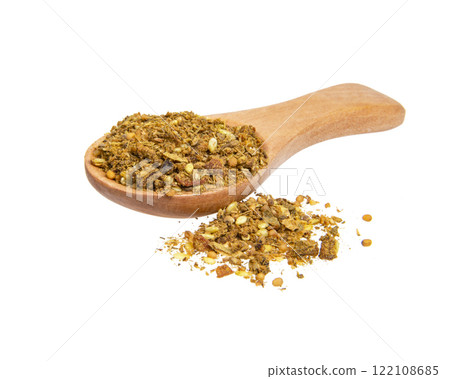 Dried aromatic spices in wooden spoon isolated on the white background Dried aromatic spices in wooden spoon isolated on the white background 122108685