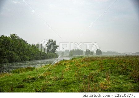 Beautiful landscape with blue sky and clouds green grass field horizontal view 122108775