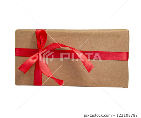 Craft gift box with red color bow isolated on the white background with copyspace Craft gift box with red color bow isolated on the white background with copyspace 122108782