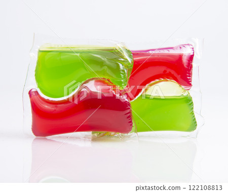 Red green capsule for cloth washing liquid powder isolated on the white background Red green capsule for cloth washing liquid powder isolated on the white background 122108813