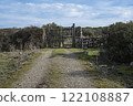 Rustic wooden gate with dry stone wall in a rural countryside 122108887