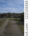 Rustic wooden gate with dry stone wall in a rural countryside 122108888