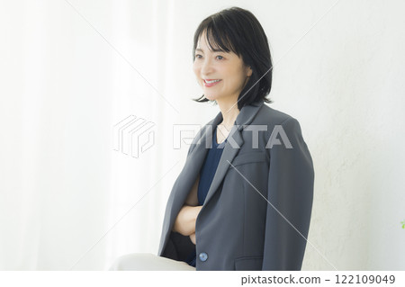 Middle-aged woman in a suit 122109049