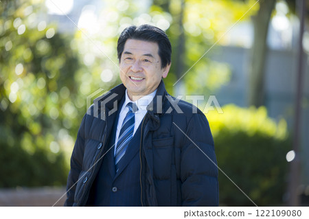 Senior man in a suit in the park Senior man in a suit in the park 122109080