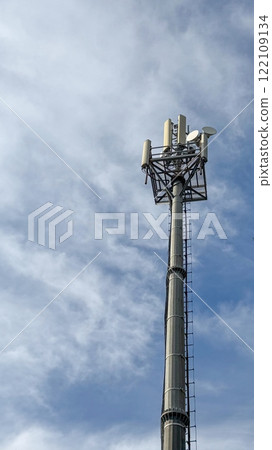 Mobile data tower with antennas against a blue sky 122109134