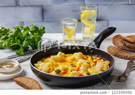 cauliflower, zucchini and red bell pepper frittata cauliflower, zucchini and red bell pepper frittata 122109500