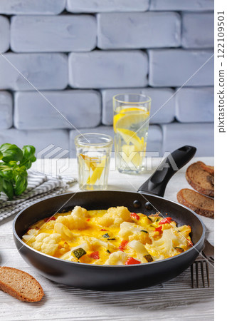 cauliflower, zucchini and red bell pepper frittata 122109501