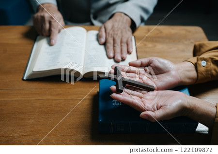 Men and women praying to God with the Bible, seeking blessings and guidance. heartfelt depiction of faith, devotion, and spiritual connection. Men and women praying to God with the Bible, seeking blessings and guidance. heartfelt depiction of faith, devotion, and spiritual connection. 122109872