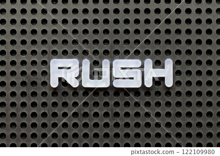 White color letter in word rush on black pegboard background 122109980