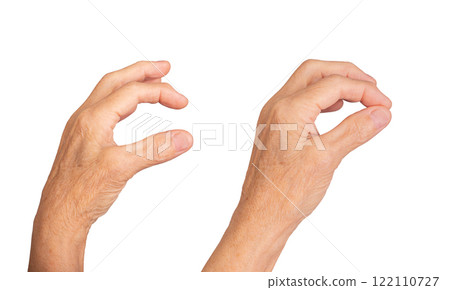 Elderly female hand pinching with two fingers, gesture holding something small or invisible, 122110727