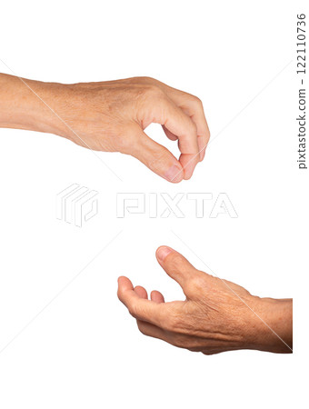 Elderly caucasian woman's hand open with palm up, fingers slightly curled in a gesture of offering 122110736