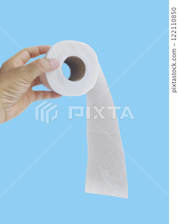 Hand Holding a Roll of Toilet Paper on blue background Hand Holding a Roll of Toilet Paper on blue background 122110850